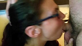 Kristine Boag delivers a homemade blowjob with glasses on, sucking amateur cock passionately.