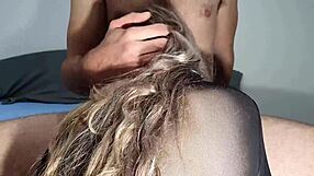 Cute girl rides big cock while sucking it eagerly.