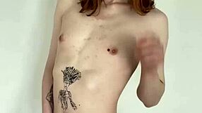 The tattooed transsexual slut jerks her cock in a solo masturbation session