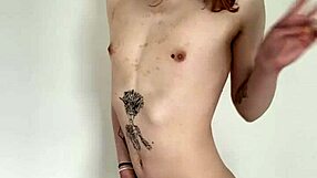 The tattooed transsexual slut jerks her cock in a solo masturbation session