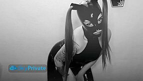 Mistress Emily Doomed delivers squeaky PVC jerk-off instructions while teasing in oiled latex gloves