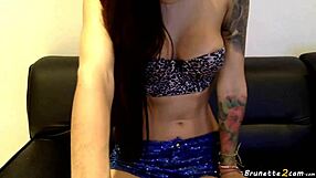 Tattooed brunette reveals her tight pussy in emotional webcam show