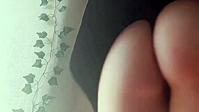 The Sexy Redhead Stands in the Wind, Her Hair Flowing Freely as She Poses Seductively