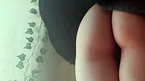 The Sexy Redhead Stands in the Wind, Her Hair Flowing Freely as She Poses Seductively