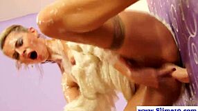 In a glamorous gloryhole setting, classy blonde lesbians participate in a blowbang, receiving cum facials and bukkake from multiple partners