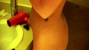 Kayden Krush combs her hair nude, showing medium breasts.