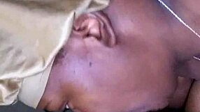 Side view of ebony teen with big tits and tattoo sucking monster cock at work, leading to cumshot.