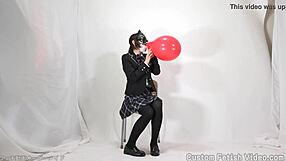 Girl excitedly plays with balloons