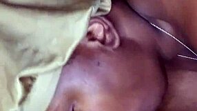 Side view of ebony teen with big tits and tattoo sucking monster cock at work, leading to cumshot.