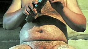 russian gay guy with painted lips uses a store cucumber