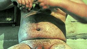 russian gay guy with painted lips uses a store cucumber