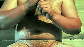 russian gay guy with painted lips uses a store cucumber