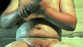 russian gay guy with painted lips uses a store cucumber