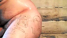 russian gay guy with painted lips uses a store cucumber