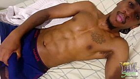 Ebony amateur masturbates cock to cumshot with high vibrations.