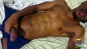 Ebony amateur masturbates cock to cumshot with high vibrations.