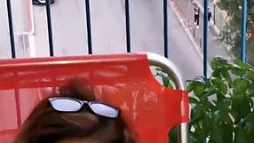 Stepmother masturbates on balcony