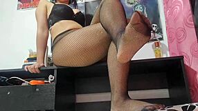 Latina teen features her fishnet stockings and feet