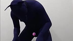 She's wearing zentai with a dog penis, fucking her masked slave in femdom style.
