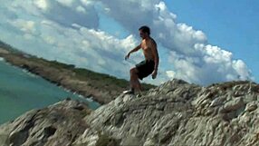 Fiery redhead gets pounded hard on the rocks, she moans during outdoor blowjob