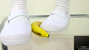 Watch this asian girl crush a banana with her feet in a japanese food fetish video?