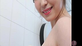 Beautiful woman dances seductively in bathroom swimsuit.