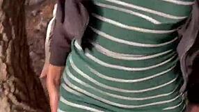 Brunette babe flashes in public and engages in risky clothed sex at a busy viewpoint, leading to a hardcore creampie