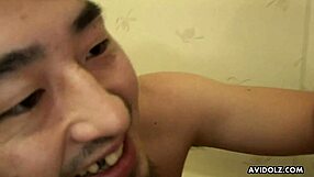 precious asian lass sucking a dick in a wet shower