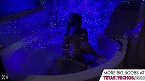 blue shows off her big tits in the bath tub
