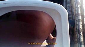 African Woman in Mini Skirt Toys Herself on Chair