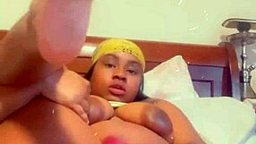 Nude Ebony hunk pleasures himself with anal toy