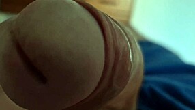 I capture a close-up of my dick's head in this homemade gay video.