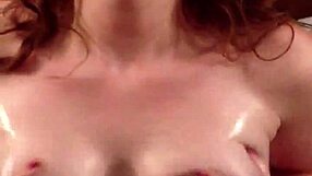 Redhead teases with oiled tits and jerk off instructions