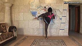 Teen ballerina intensely stretches legs revealing huge tits in gym