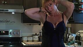 Cute redhead dances in kitchen