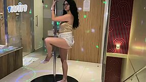 Young dancer twerks pole with naughty expression