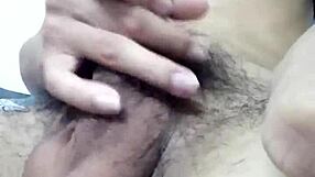 Gay man in kitchen sucking cock while preparing meal