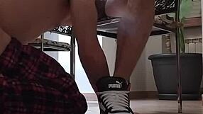 Slave pumps while master smokes cigar to relax.