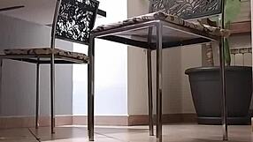 Slave pumps while master smokes cigar to relax.