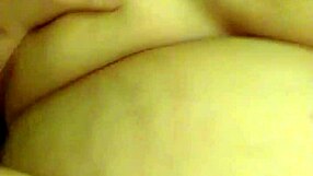 Amanda showcases her large breasts and curvy body.