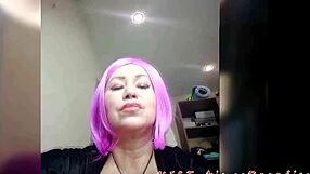 Beautiful mature whore with purple hair rubs her clit through see-through panties. She moans loudly.