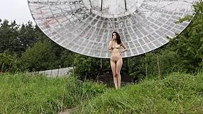 Brunette's Natural Tits Exposed in Public Nude Shoot Near Old Space Radar