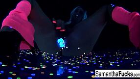 samantha saint touches her big tits and ass in black light solo