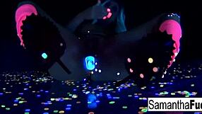 samantha saint touches her big tits and ass in black light solo