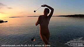 Pretty European Girl's Nude Fire Dancing On Usa Beach At Sunset