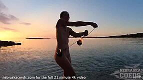 Pretty European Girl's Nude Fire Dancing On Usa Beach At Sunset