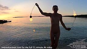 Pretty European Girl's Nude Fire Dancing On Usa Beach At Sunset