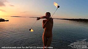 Pretty European Girl's Nude Fire Dancing On Usa Beach At Sunset