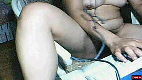 A webcam babe performs in an amateur sex video.
