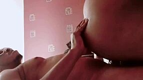 Fat black ass contrasts with big cock sucking